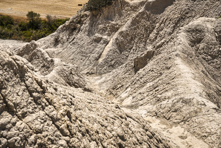 Detail of structures of eroded hills of Komolithi earth pyramids on the island of Creteの写真素材