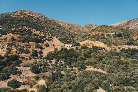 A single building on the slopes of the mountains located in western Creteの写真素材