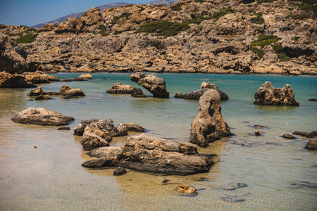 Landscape with single stones in White Lake on the sandy coast of the Mediterranean Sea on the island of Creteの写真素材
