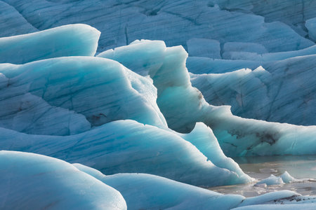 Beautiful glaciers flow through the mountains in Iceland.の写真素材