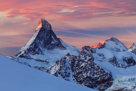 Matterhorn during winter. It is a mountain of the Alps, straddling the main watershed and border between Switzerland and Italy.Beautiful mountain landscape with views of the Matterhorn peak in Zermattの写真素材