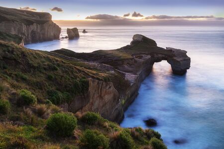 Cliff formations at Tunnel Beach, Dunedin, South Island, New Zealandの写真素材