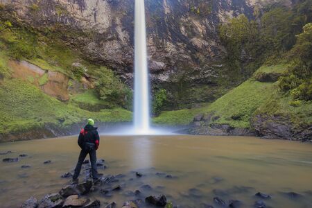 Panoramic photo landscape / Waterfall hidden in tropical jungle surrounded by natural swimming pool...