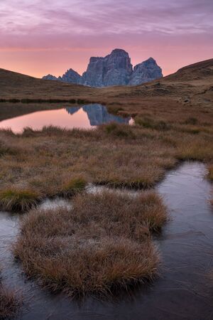 Amazing view of famous Dolomite peaks glowing in beautiful golden evening light at sunset in summer. Trentino Alto Adige, Dolomites Mountains, South Tyrol, Italy, Europe. Beautiful landscape backgrounの写真素材