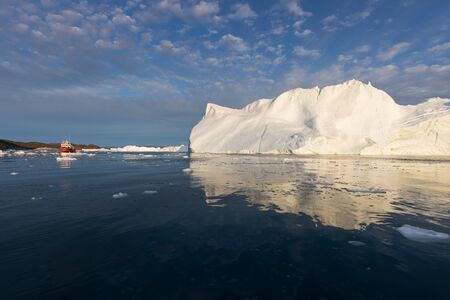 Greenland or Antarctica. Travel on ship among ices. Studying of global warming phenomenon Ices and...