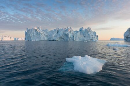 Greenland or Antarctica. Travel on ship among ices. Studying of global warming phenomenon Ices and...
