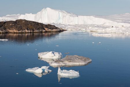 Greenland or Antarctica. Travel on ship among ices. Studying of global warming phenomenon Ices and...