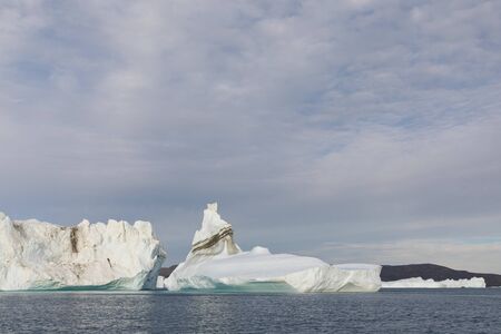 Greenland or Antarctica. Travel on ship among ices. Studying of global warming phenomenon Ices and...