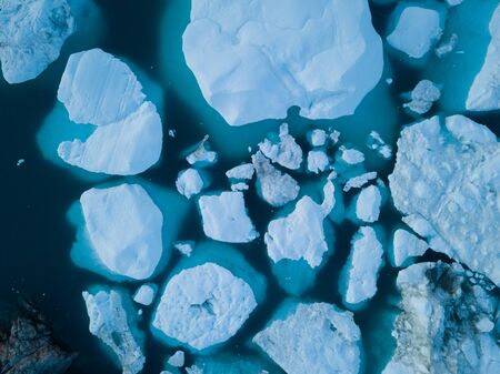 Icebergs drone aerial image - Climate Change and Global Warming. Icebergs from melting glacier in...