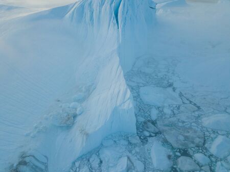 Icebergs drone aerial image - Climate Change and Global Warming. Icebergs from melting glacier in...