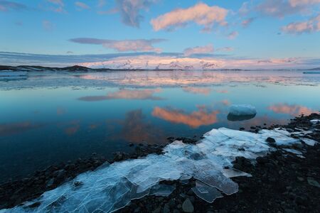 Beautiful sunset over the famous Diamond beach, Iceland. Jokulsarlon glacial ice gems ice glacier...