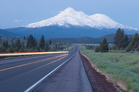 Road towards Mount Shasta and Shastina in California, United States Highway 97 in Northern California heading South towards a mountain called Shasta volcano, USAの写真素材