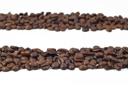 Roasted coffee beans on white backgroundの写真素材