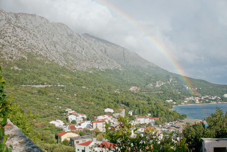 Rainbow over Igrane - Beautiful village in Dalmatia, Croatia の写真素材