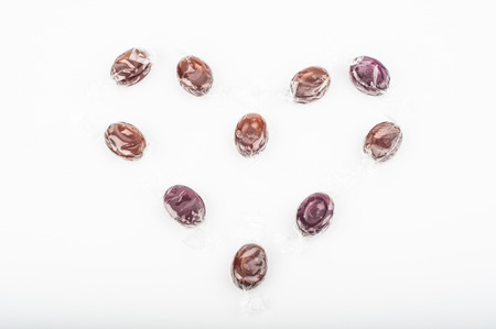 Photo of candies heart on white backgroundの写真素材