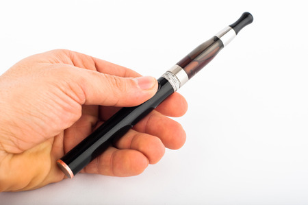 Photo of hand with electronic cigarette agains white backgroundの写真素材