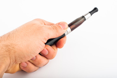 Photo of hand with electronic cigarette agains white backgroundの写真素材