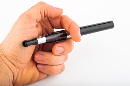 Photo of hand with electronic cigarette agains white backgroundの写真素材