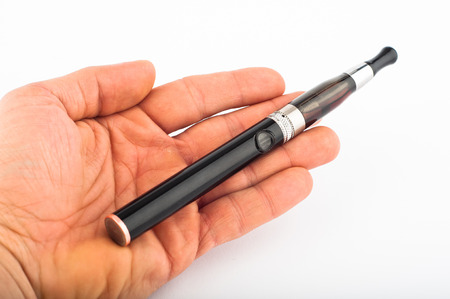 Photo of hand with electronic cigarette agains white backgroundの写真素材