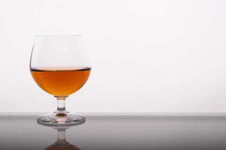 Photo of cognac glass against white backgroundの写真素材