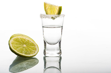 Photo of shot of vodka against white backgroundの写真素材