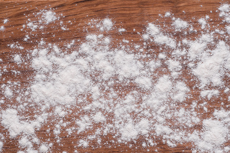 photo of flour on brown wooden tableの写真素材