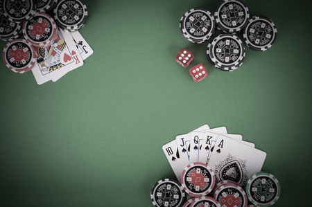 photo of top view of green casino table with royal flush, red and black chips - vintageの写真素材