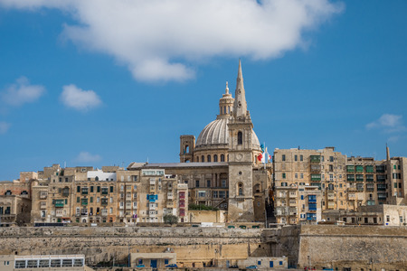 photo of Valletta, Malta, skyline of capitol city with blue sky and clouds as backgroundの写真素材
