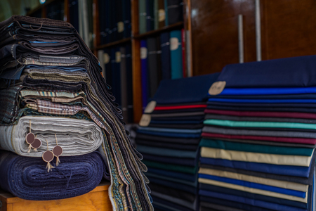 Photo of Rolls of textiles in a fabric shop. Multi colors and patterns.の写真素材