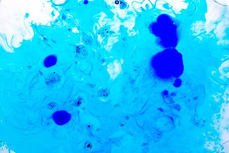 Photo of Abstract blured background from blue ink, milk and oil