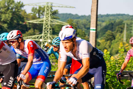 PORÄBKA NEAR BIELSKO-BIALA, POLAND - AUGUST 13, 2021: Cycling race "Tour de Pologne" 2021, stage 5 from Chocholow, Czarny Dunajec (pol. ChochoÅÃ³w) to Bielsko-BiaÅa, professional cyclist riding throught streets in PorÄbka, near Kocierz, Przegibek and のeditorial素材