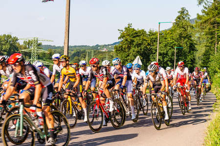 PORÄBKA NEAR BIELSKO-BIALA, POLAND - AUGUST 13, 2021: Cycling race "Tour de Pologne" 2021, stage 5 from Chocholow, Czarny Dunajec (pol. ChochoÅÃ³w) to Bielsko-BiaÅa, professional cyclist riding throught streets in PorÄbka, near Kocierz, Przegibek and のeditorial素材