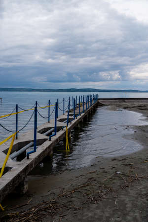 Photo of Balaton Lake shore in Hungary. Cloudy sky as background.の写真素材