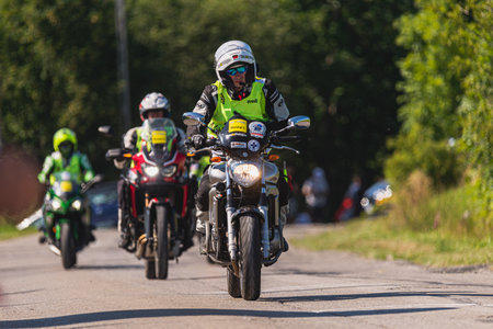 BUDZOW, POLAND - AUGUST 5, 2022: Cycling race "Tour de Pologne" 2022, stage 7 from Skawina to Krakow, professional cyclist riding uphill (KoM in BudzÃ³w)のeditorial素材