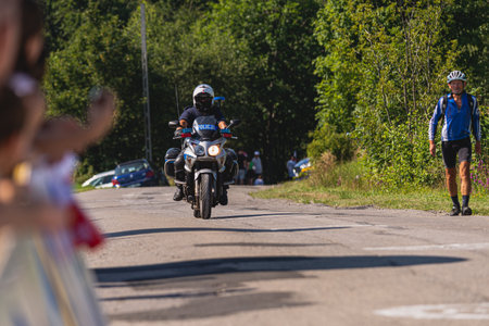 BUDZOW, POLAND - AUGUST 5, 2022: Cycling race "Tour de Pologne" 2022, stage 7 from Skawina to Krakow, professional cyclist riding uphill (KoM in BudzÃ³w)のeditorial素材