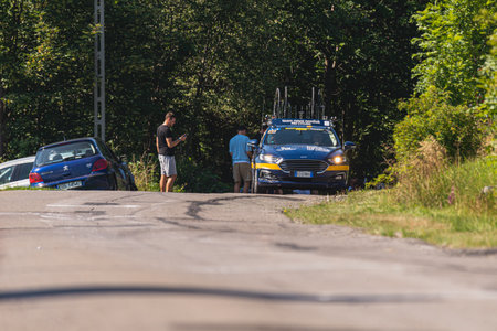 BUDZOW, POLAND - AUGUST 5, 2022: Cycling race "Tour de Pologne" 2022, stage 7 from Skawina to Krakow, professional cyclist riding uphill (KoM in BudzÃ³w)のeditorial素材