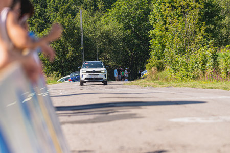 BUDZOW, POLAND - AUGUST 5, 2022: Cycling race "Tour de Pologne" 2022, stage 7 from Skawina to Krakow, professional cyclist riding uphill (KoM in BudzÃ³w)のeditorial素材