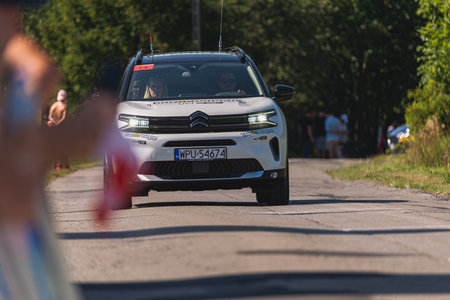 BUDZOW, POLAND - AUGUST 5, 2022: Cycling race "Tour de Pologne" 2022, stage 7 from Skawina to Krakow, professional cyclist riding uphill (KoM in BudzÃ³w)のeditorial素材