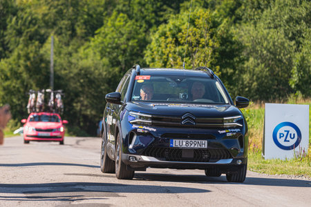 BUDZOW, POLAND - AUGUST 5, 2022: Cycling race "Tour de Pologne" 2022, stage 7 from Skawina to Krakow, professional cyclist riding uphill (KoM in BudzÃ³w)のeditorial素材