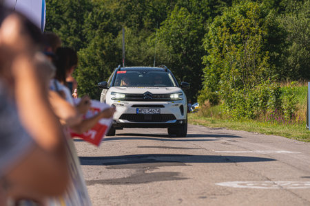 BUDZOW, POLAND - AUGUST 5, 2022: Cycling race "Tour de Pologne" 2022, stage 7 from Skawina to Krakow, professional cyclist riding uphill (KoM in BudzÃ³w)のeditorial素材
