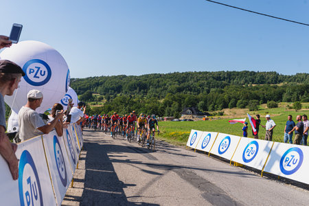 BUDZOW, POLAND - AUGUST 5, 2022: Cycling race "Tour de Pologne" 2022, stage 7 from Skawina to Krakow, professional cyclist riding uphill (KoM in BudzÃ³w)のeditorial素材