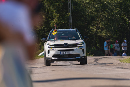 BUDZOW, POLAND - AUGUST 5, 2022: Cycling race "Tour de Pologne" 2022, stage 7 from Skawina to Krakow, professional cyclist riding uphill (KoM in BudzÃ³w)のeditorial素材