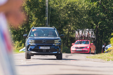 BUDZOW, POLAND - AUGUST 5, 2022: Cycling race "Tour de Pologne" 2022, stage 7 from Skawina to Krakow, professional cyclist riding uphill (KoM in BudzÃ³w)のeditorial素材