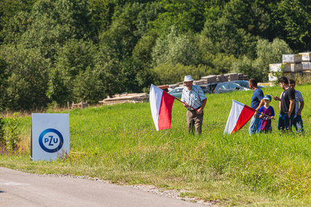 BUDZOW, POLAND - AUGUST 5, 2022: Cycling race "Tour de Pologne" 2022, stage 7 from Skawina to Krakow, professional cyclist riding uphill (KoM in BudzÃ³w)のeditorial素材