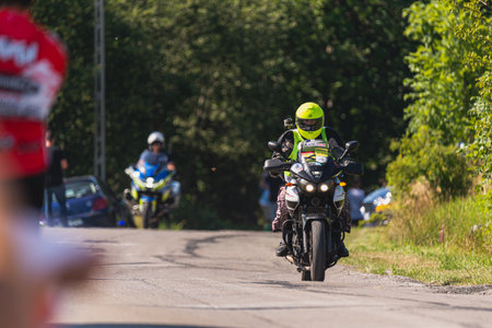 BUDZOW, POLAND - AUGUST 5, 2022: Cycling race "Tour de Pologne" 2022, stage 7 from Skawina to Krakow, professional cyclist riding uphill (KoM in BudzÃ³w)のeditorial素材