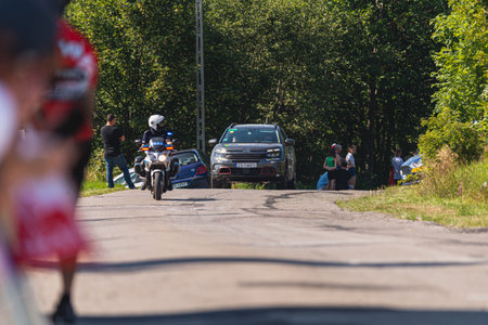 BUDZOW, POLAND - AUGUST 5, 2022: Cycling race "Tour de Pologne" 2022, stage 7 from Skawina to Krakow, professional cyclist riding uphill (KoM in BudzÃ³w)のeditorial素材