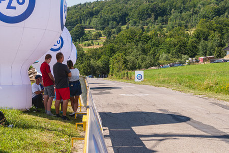 BUDZOW, POLAND - AUGUST 5, 2022: Cycling race "Tour de Pologne" 2022, stage 7 from Skawina to Krakow, professional cyclist riding uphill (KoM in BudzÃ³w)のeditorial素材