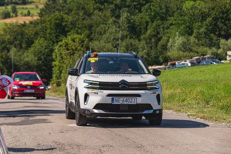 BUDZOW, POLAND - AUGUST 5, 2022: Cycling race "Tour de Pologne" 2022, stage 7 from Skawina to Krakow, professional cyclist riding uphill (KoM in BudzÃ³w)のeditorial素材