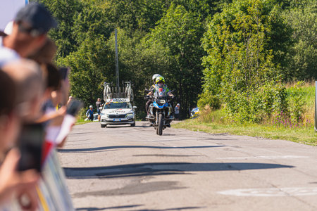 BUDZOW, POLAND - AUGUST 5, 2022: Cycling race "Tour de Pologne" 2022, stage 7 from Skawina to Krakow, professional cyclist riding uphill (KoM in BudzÃ³w)のeditorial素材