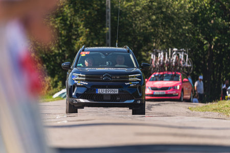 BUDZOW, POLAND - AUGUST 5, 2022: Cycling race "Tour de Pologne" 2022, stage 7 from Skawina to Krakow, professional cyclist riding uphill (KoM in BudzÃ³w)のeditorial素材